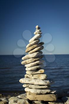 stones stacked on each other on the background of the ocean