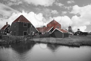 Traditional houses in Holland town Volendam, Netherlands. black and red and white photo
