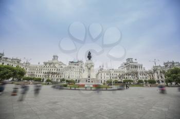 square in the center of which stands a monument to a man on a horse. Lima, Peru.