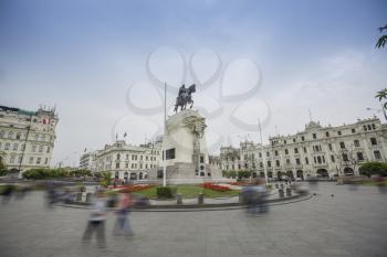 square in the center of which stands a monument to a man on a horse. Lima, Peru.