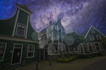 Night landscape of the Starry sky. Traditional houses in Holland town Volendam 