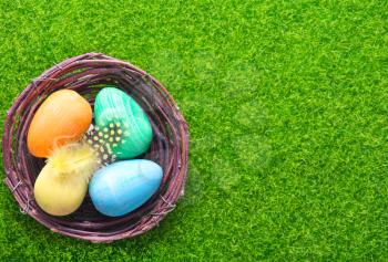 decorative painted Easter eggs on a table, easter background