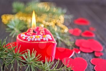 candle and christmas decoration on a table