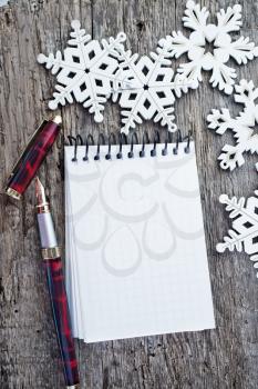 Christmas background, artificial snowflakes wood on wooden background