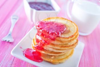 pancakes with raspberry jam on the plate