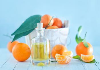 Tangerine essential oil on the white table