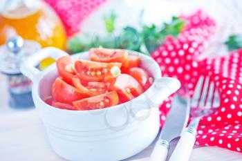 tomato salad in bowl and on a table