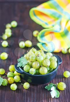 gooseberry in bowl and on a table