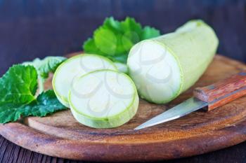 fresh marrow on the wooden background