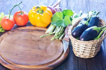 fresh vegetables on the wooden kitchen table