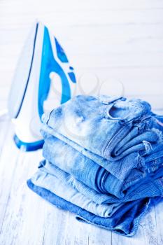 stack of jeans on the white plate
