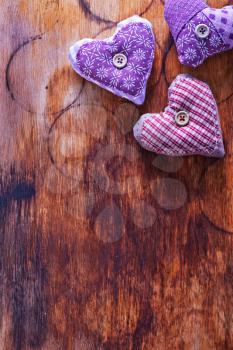 Love hearts on vintage wood, violet hearts