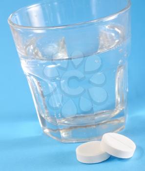 white pills and water
