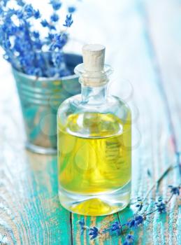 lavender oil in glass bottle on the green table