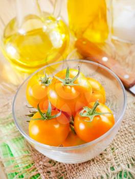 yellow tomato in the glass bowl
