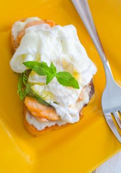 Close Up of Poached Delicious Egg with Whole Grain Bread