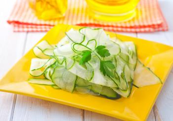 Fresh salad with fresh cucumber and parsley
