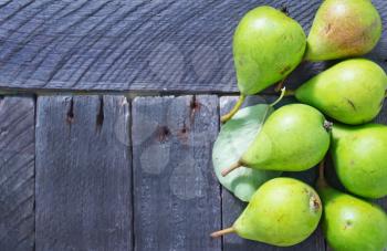 green pears, fresh pears on the wooden table