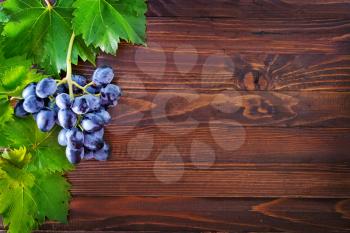 fresh grape on the wooden table, grape on a table