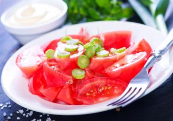tomato salad on plate and on a table