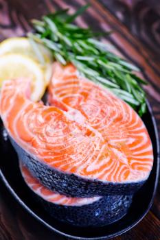 fresh salmon with rosemary on the plate