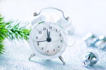 white clock on the white table, christmas background