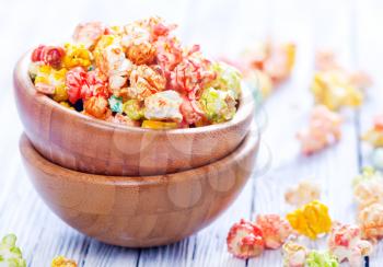 color popcorn in bowls and on a table