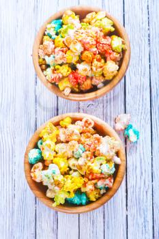 color popcorn in bowls and on a table