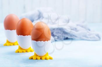 boiled eggs on the blue table, breakfast