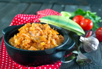 fried cabbage with meat and tomato sauce