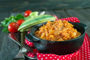fried cabbage with meat and tomato sauce