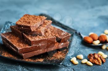 chocolate and nuts on plate, stock photo