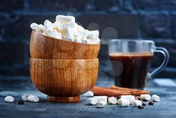 white marshmellow in bowl and on a table