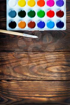 color paint and brushes on a table