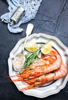 boiled shrimps on plate, shrimps with salt and lemon