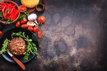 Products for preparation of burgers: buns, tomatoes, sauce, cutlets