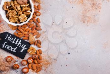 Mix nuts on beton background. Cut nuts