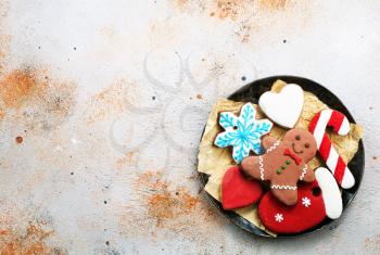 sweet christmas cookie on plate and on a table