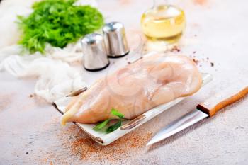 raw chicken fillet with salt, stock photo