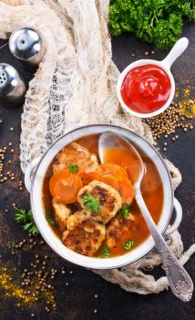 cutlets with tomato sauce in white bowl