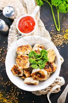 cutlets in bowl and on the table, stock photo