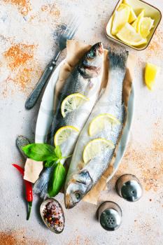 raw fish with spice and salt, fish with  lemon and aroma herb