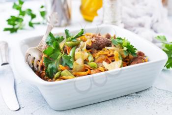 baked meat with green beans, meat with vegetables, stock photo
