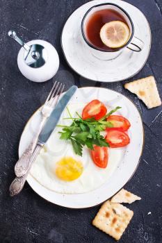 fried eggs with salad on the plate, stock photo