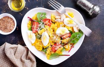 pasta with boiled eggs and cheese in bowl