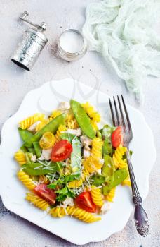 pasta with grilled chicken meat, vegetables and cheese