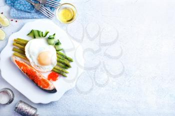 breakfast, fried fish with asparagus and egg