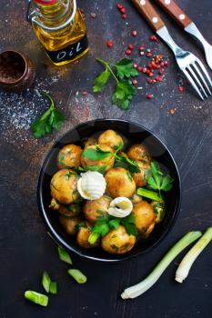 boiled potato with fresh greens and butter