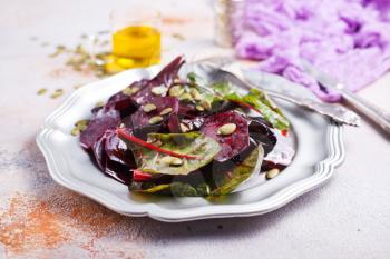 beet salad with nuts on metal plate