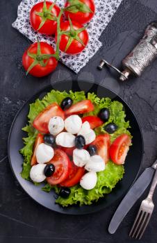 Vegetable salad on plate, greek salad, fresh salad with feta cheese
